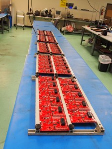 About 25 boards waiting for wave soldering of the PTH parts